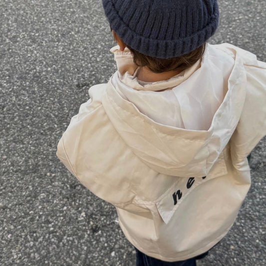 Rain-jacket beige écriture